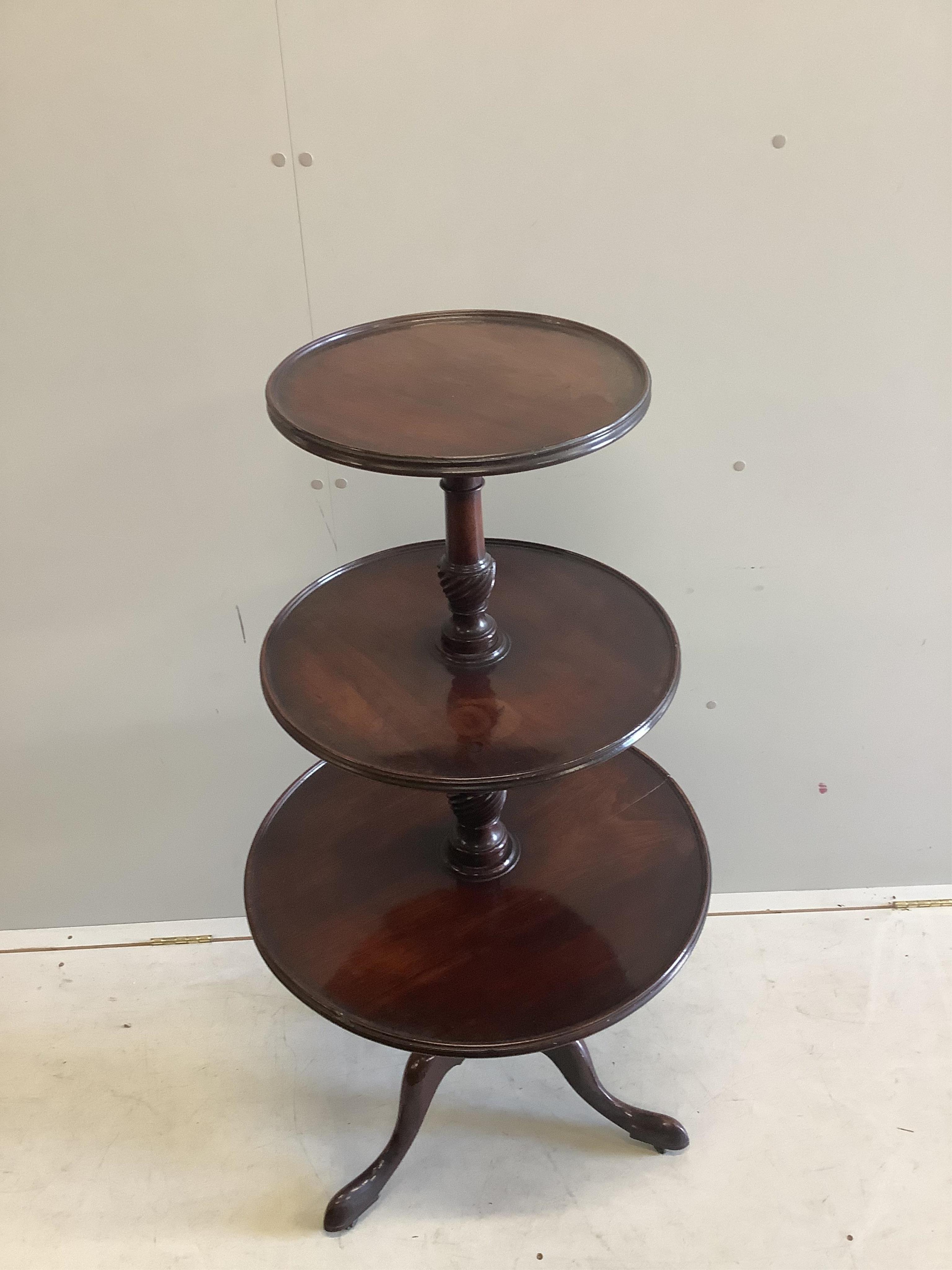 An early 19th century mahogany three tier dumb waiter, diameter 62cm, height 120cm